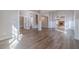 Open living area with hardwood floors, modern lighting, and seamlessly connected rooms at 167 Pinewood Dr, Covington, GA 30014