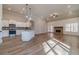 Open concept living space featuring a kitchen island, fireplace and lots of natural light at 167 Pinewood Dr, Covington, GA 30014