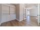 Home office with built-in shelving, hardwood floors, and elegant glass door access at 167 Pinewood Dr, Covington, GA 30014