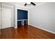 Bright bedroom featuring hardwood floors, neutral walls, and a walk-in closet with shelving at 510 Coventry Rd # 8A, Decatur, GA 30030