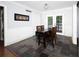 Bright dining area with stone tile floor, beadboard wainscotting and doors leading to the deck at 510 Coventry Rd # 8A, Decatur, GA 30030
