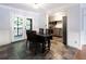 Dining area with slate floors and kitchen view; door leads to outdoor porch at 510 Coventry Rd # 8A, Decatur, GA 30030