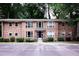 Charming brick condo building featuring well-maintained landscaping and reserved parking at 510 Coventry Rd # 8A, Decatur, GA 30030