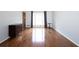 Sun-filled living room with shiny hardwood floors, front door and large window with custom curtains at 510 Coventry Rd # 8A, Decatur, GA 30030