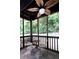 Cozy screened porch with tiled floor, fan, and views of the wooded backyard at 510 Coventry Rd # 8A, Decatur, GA 30030
