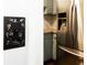 Decorative light switch and stainless steel refrigerator in the kitchen at 510 Coventry Rd # 8A, Decatur, GA 30030