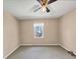 Bedroom with carpet, standard window and ceiling fan at 5221 La Paloma Sw Dr, Lilburn, GA 30047