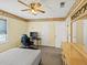 Bedroom with desk, chair, bed, and window, providing space to study and relax at 5221 La Paloma Sw Dr, Lilburn, GA 30047