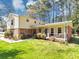 Charming home boasting a cozy front porch, brick accents, vinyl siding, and a well-manicured lawn at 5221 La Paloma Sw Dr, Lilburn, GA 30047