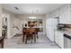 Eat-in kitchen featuring an adjacent dining area, granite countertops and stainless steel appliances at 5221 La Paloma Sw Dr, Lilburn, GA 30047
