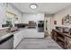 Bright kitchen with white cabinets, granite countertops, stainless steel appliances and plank flooring at 5221 La Paloma Sw Dr, Lilburn, GA 30047
