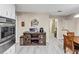 Well-lit kitchen with stainless steel appliances, a wooden island, and an adjacent dining area at 5221 La Paloma Sw Dr, Lilburn, GA 30047