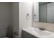 Simple bathroom featuring a sleek sink and a mirror, for a clean and minimalistic space at 6136 Marbut Rd, Lithonia, GA 30058