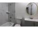 Beautiful bathroom with marble tiling, a tub, shower, a nice mirror and a modern sink for a comfortable experience at 6136 Marbut Rd, Lithonia, GA 30058