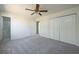 Spacious bedroom with a ceiling fan and carpet floors that provide a warm and comforting living space at 6136 Marbut Rd, Lithonia, GA 30058