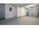 Clean, attached garage with finished walls, door to inside, and an automatic door at 6136 Marbut Rd, Lithonia, GA 30058