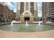 Elegant apartment building entrance with a fountain and a well-maintained landscape at 795 Hammond Dr # 1108, Atlanta, GA 30328