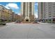 Exterior view of the high-rise condos with well-maintained front and landscaping at 795 Hammond Dr # 1108, Atlanta, GA 30328