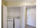 Convenient in-unit laundry closet featuring a stacked washer and dryer and extra storage space at 795 Hammond Dr # 1108, Atlanta, GA 30328