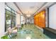 An elegant lobby featuring large windows, stone floors, and stylish seating at 795 Hammond Dr # 1108, Atlanta, GA 30328