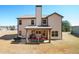 Rear exterior of the home featuring a covered patio and well-maintained landscaping at 2320 Ridge View Dr, Loganville, GA 30052