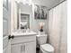 Well-lit half bath featuring modern fixtures and stylish decor at 2320 Ridge View Dr, Loganville, GA 30052