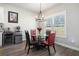Cozy breakfast nook with a modern light fixture, adjacent to kitchen, and hardwood floors at 2320 Ridge View Dr, Loganville, GA 30052