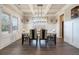 Elegant dining room with modern lighting, wainscoting, and hardwood floors for formal dining at 2320 Ridge View Dr, Loganville, GA 30052