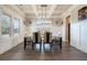 Bright dining room featuring modern lighting, neutral colors, and hardwood floors at 2320 Ridge View Dr, Loganville, GA 30052