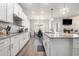 Bright kitchen features stainless appliances, tile backsplash, granite countertops, and hardwood floors at 2320 Ridge View Dr, Loganville, GA 30052