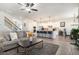 Open-concept living area with a view of the kitchen, hardwood floors, and ample seating arrangement at 2320 Ridge View Dr, Loganville, GA 30052
