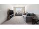 Comfortable living room features neutral tones, plush seating, a large window, and a TV for relaxation at 2320 Ridge View Dr, Loganville, GA 30052