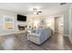 Cozy living room with a fireplace, neutral tones, and ample natural light at 2320 Ridge View Dr, Loganville, GA 30052