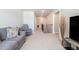 Upstairs loft area includes a grey couch, a mounted TV, and a view of the stairwell at 2320 Ridge View Dr, Loganville, GA 30052