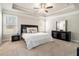 Spacious main bedroom featuring a tray ceiling, carpet, and plenty of natural light at 2320 Ridge View Dr, Loganville, GA 30052