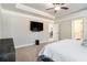 Spacious main bedroom featuring a mounted TV and an attached bathroom for convenience at 2320 Ridge View Dr, Loganville, GA 30052