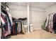 Spacious walk-in closet with carpet, built-in shelving, and ample storage space at 2320 Ridge View Dr, Loganville, GA 30052