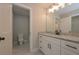 Modern bathroom with granite countertop vanity, white cabinets, and a view into the water closet with a toilet at 4850 Cool Springs Rd, Winston, GA 30187