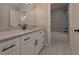 Bathroom with granite countertop vanity, white cabinets, and a view into the water closet with a tiled shower at 4850 Cool Springs Rd, Winston, GA 30187
