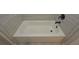 Bathroom bathtub with gray tile surround, and black fixtures at 4850 Cool Springs Rd, Winston, GA 30187