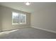 Well-lit bedroom with plush carpet and a large window offering ample natural light at 4850 Cool Springs Rd, Winston, GA 30187