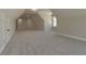 Expansive bonus room showcasing pitched ceilings and plush carpeting, offering versatile space at 4850 Cool Springs Rd, Winston, GA 30187