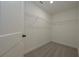 Walk-in closet with carpet and metal shelving for maximizing organization space at 4850 Cool Springs Rd, Winston, GA 30187