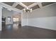 Open dining room features wainscoting, modern chandelier, and hardwood floors at 4850 Cool Springs Rd, Winston, GA 30187