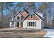 Charming two-story home with stone and wood accents and a well-manicured lawn at 4850 Cool Springs Rd, Winston, GA 30187