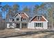 Charming two-story home with stone and wood accents and a well-manicured lawn at 4850 Cool Springs Rd, Winston, GA 30187