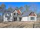 Traditional two-story home with stone accents, gabled roof, and an inviting front porch at 4850 Cool Springs Rd, Winston, GA 30187