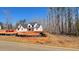 New home with unfinished construction and landscaping on a large lot at 4850 Cool Springs Rd, Winston, GA 30187