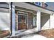 Inviting front entrance with double wood doors and stone accents at 4850 Cool Springs Rd, Winston, GA 30187