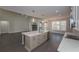 Open kitchen and living room feature an island and stone fireplace at 4850 Cool Springs Rd, Winston, GA 30187